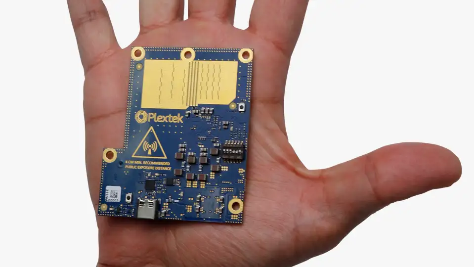 A mmWave radar module fitting into the palm of someone's hand